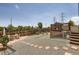 Outdoor living space featuring a well maintained yard, deck, stone pavers and fencing with power lines overhead at 3762 S Halifax St, Aurora, CO 80013