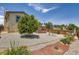 Landscaped backyard with a mature tree, pea gravel, rock landscaping, and a tiered deck for outdoor enjoyment at 3762 S Halifax St, Aurora, CO 80013