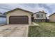 Lovely home with a two-car garage, well-maintained lawn, and classic architecture at 3762 S Halifax St, Aurora, CO 80013