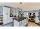 Modern kitchen with a large island, open floor plan, and seamless transition to the living room at 3762 S Halifax St, Aurora, CO 80013