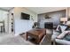 Relaxing living area with a cozy fireplace, modern furniture, and a television mounted on the wall at 3762 S Halifax St, Aurora, CO 80013