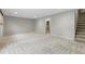 Spacious, carpeted basement with recessed lighting and a staircase, ideal for recreation at 6205 Pierce St, Arvada, CO 80003