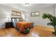 Cozy bedroom with hardwood floors, two windows, and tasteful décor for a relaxing atmosphere at 6205 Pierce St, Arvada, CO 80003