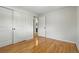 Bedroom with hardwood flooring, closet, and a neutral color palette, creating a serene space at 6205 Pierce St, Arvada, CO 80003