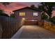 Exterior of brick home with a two-car garage and well-manicured front yard at 6205 Pierce St, Arvada, CO 80003