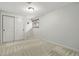 This bedroom features neutral walls, carpet, a window and a closet with double doors at 6205 Pierce St, Arvada, CO 80003
