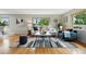 Bright living room with large windows and a stylish grey striped rug at 6205 Pierce St, Arvada, CO 80003
