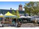 Vibrant outdoor seating area at brewery with motorcycle parked in front at 6205 Pierce St, Arvada, CO 80003