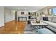 Bright living room showcasing hardwood floors, stylish decor, and an open concept layout at 6205 Pierce St, Arvada, CO 80003