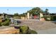 Scenic park view with a playground, seating, and decorative landscaping for community enjoyment at 6205 Pierce St, Arvada, CO 80003