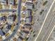 Aerial view of houses in a neighborhood showing their roof types and street layout at 23593 E Eads Dr, Aurora, CO 80016