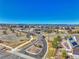 An expansive aerial view of the community showcasing the layout, landscaping, and surrounding mountains at 23593 E Eads Dr, Aurora, CO 80016