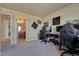 Well-lit bedroom with desk and two chairs, across from an open-door view into a bathroom at 23593 E Eads Dr, Aurora, CO 80016