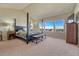 Spacious main bedroom boasting lots of natural light, vaulted ceilings, and a four-poster bed at 23593 E Eads Dr, Aurora, CO 80016