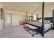 Spacious main bedroom with vaulted ceilings, carpeted floors, four poster bed and lots of storage space at 23593 E Eads Dr, Aurora, CO 80016