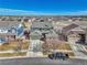 Two-story home featuring well-maintained lawn, mature trees, and a two-car garage, set against a backdrop of expansive sky at 23593 E Eads Dr, Aurora, CO 80016