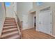 Inviting foyer with hardwood floors, staircase, and neutral paint palette that create a warm, welcoming atmosphere at 23593 E Eads Dr, Aurora, CO 80016