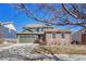 Charming two-story home with a manicured lawn, stone accents, and a two-car garage at 23593 E Eads Dr, Aurora, CO 80016