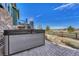 Backyard patio with a hot tub and a view of the lush landscape at 23593 E Eads Dr, Aurora, CO 80016