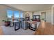 Bright living room with large windows, plush seating, a modern fireplace, and stylish decor, creating a cozy and welcoming ambiance at 23593 E Eads Dr, Aurora, CO 80016