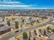 Aerial view of neighborhood amenities, including tennis courts, a playground, walking paths, and picnic shelter at 23593 E Eads Dr, Aurora, CO 80016