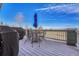 Relaxing outdoor deck featuring a table and chairs, ideal for outdoor dining at 23593 E Eads Dr, Aurora, CO 80016