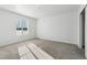 Bedroom featuring neutral walls and carpet with a sun filled window at 16651 W 93Rd Ave, Arvada, CO 80007