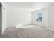 Bright bedroom with neutral walls and carpet with a double door closet and sunny window at 16651 W 93Rd Ave, Arvada, CO 80007