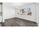 Dining area features wood floors and ample light from multiple windows at 16651 W 93Rd Ave, Arvada, CO 80007
