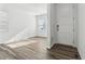 Clean entryway with wood floors, natural light, and a modern door, creating a welcoming entrance at 16651 W 93Rd Ave, Arvada, CO 80007