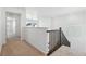 Second floor hallway with white walls and carpeted floors at 16651 W 93Rd Ave, Arvada, CO 80007