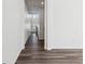 Hallway showcasing the modern design and open layout of the home with wood flooring at 16651 W 93Rd Ave, Arvada, CO 80007