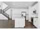 Modern kitchen featuring white cabinets, stainless steel appliances, and a center island with bar seating at 16651 W 93Rd Ave, Arvada, CO 80007