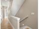 Bright hallway with natural light, neutral walls, and access to a staircase at 888 S Valentia St # 102, Denver, CO 80247