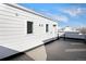 Spacious rooftop deck with sleek railings, ideal for outdoor relaxation and entertaining at 888 S Valentia St # 102, Denver, CO 80247