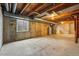 Unfinished basement with exposed ceiling and concrete floor at 12133 Bannock Cir # D, Westminster, CO 80234
