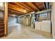 Unfinished basement area with utilities and laundry hookups at 12133 Bannock Cir # D, Westminster, CO 80234