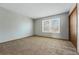 Neutral bedroom with carpet and a window providing natural light at 12133 Bannock Cir # D, Westminster, CO 80234