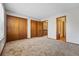 Bedroom featuring carpet, closets, and a hallway entrance at 12133 Bannock Cir # D, Westminster, CO 80234