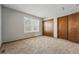 Bright bedroom featuring carpet and a closet at 12133 Bannock Cir # D, Westminster, CO 80234