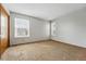 Carpeted bedroom with natural light from two windows at 12133 Bannock Cir # D, Westminster, CO 80234