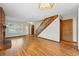 Spacious living room showcases wood floors, a cozy fireplace, and an open staircase at 12133 Bannock Cir # D, Westminster, CO 80234
