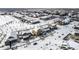 Bird's eye view showcasing a tranquil neighborhood with snow-dusted homes, sidewalks, and community spaces at 19120 E Pacific Pl, Aurora, CO 80013