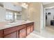 Spacious bathroom featuring dual sinks, a large mirror, and a separate shower at 19120 E Pacific Pl, Aurora, CO 80013