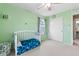 Bright bedroom featuring carpet, closet and a crib at 19120 E Pacific Pl, Aurora, CO 80013