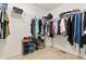 Walk-in closet offering ample storage space with clothing racks and shoe shelves at 19120 E Pacific Pl, Aurora, CO 80013