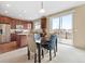 Cozy dining area with backyard access, and a modern lighting fixture, creating a welcoming space for meals at 19120 E Pacific Pl, Aurora, CO 80013