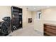 Upstairs hallway with carpet, bookcases, and a view into an adjacent room at 19120 E Pacific Pl, Aurora, CO 80013