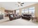 Open-concept living room and kitchen area offering ample space and natural light, perfect for modern living and entertaining at 19120 E Pacific Pl, Aurora, CO 80013