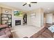 Bright living room featuring a cozy fireplace, neutral walls, and plush carpeting, creating a welcoming and relaxing space at 19120 E Pacific Pl, Aurora, CO 80013